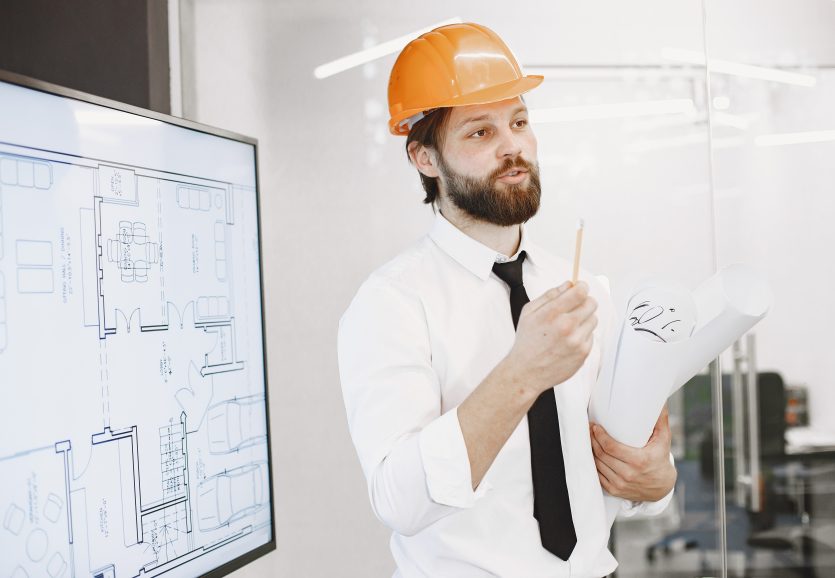 Young manager in the office with helmet